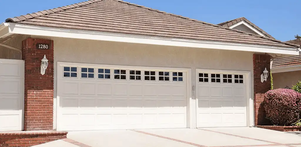 Residential garage door repair service for a double garage door in Mobile, AL