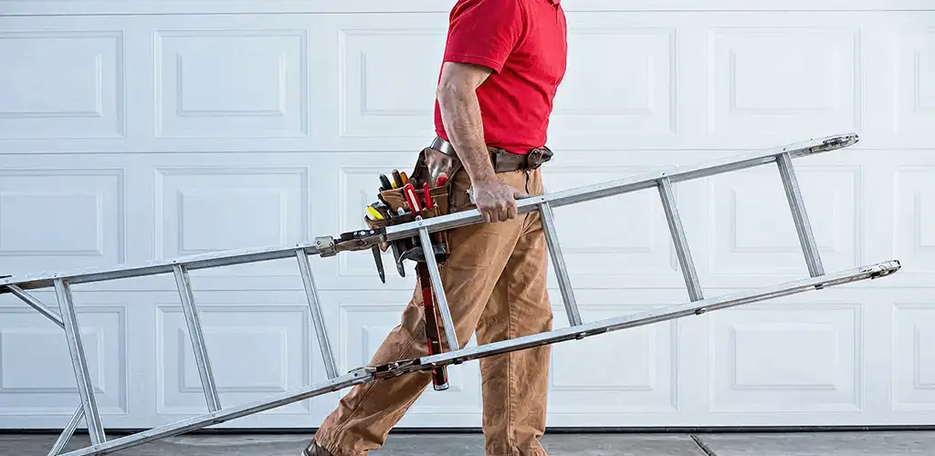 Garage door repair technician arriving with tools and ladder in Mobile, AL