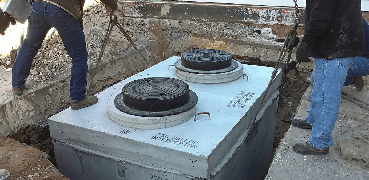 Grease trap installation for a commercial property drainage system in Mobile, AL