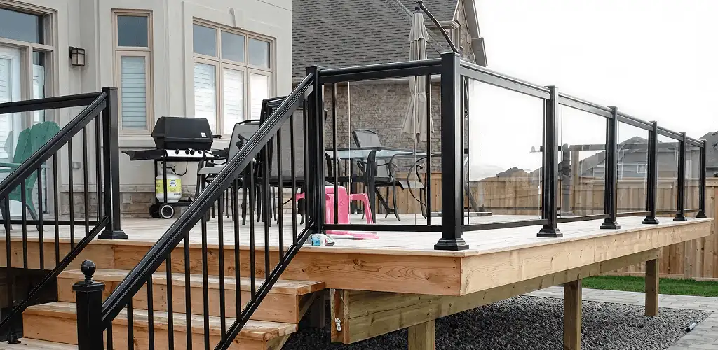 Handrail installation on a deck staircase for safety and code compliance in Mobile, AL